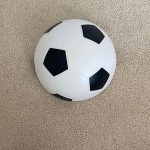a soccer ball that goes on your wall and lights up with batteries
